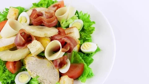 Edge of plate with Caesar salad, copy space in right side 動画素材 73507983