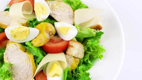 Edge of plate with Caesar salad, copy space in right side Stock Footage 73508396