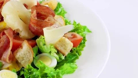 Edge of plate with deluxe Caesar salad, copy space in right side Stock-Footage 73508024