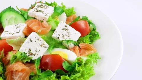 Edge of plate with fresh Salmon salad with feta cheese, copy space in right side Stock Footage 73508778