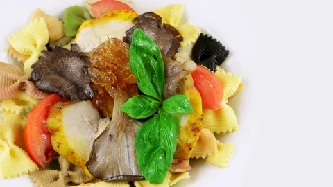 Edge of plate with Restaurant bowtie pasta with chicken, copy space Stock Footage 73654586