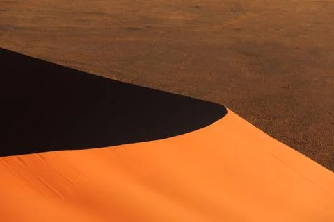 Edge red dune of always shifting sand just before sunset. sossusvlei, namibia Stock Photos