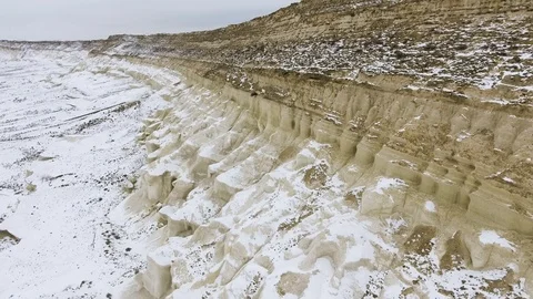 Edge of a sandy cliff of the snow-covered desert in winter. Western Kazakhstan Stock Footage 93994835