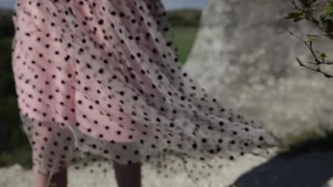 The edge of the skirt is flying in the wind Stock Footage 131384181