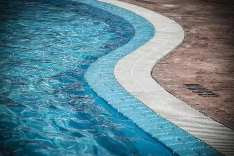 Edge of a swimming pool Stock Photos
