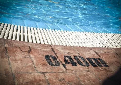 Edge of a swimming pool Stock Photos