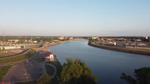 Edge of Town River Drone Shot Around Sunset Stock Footage