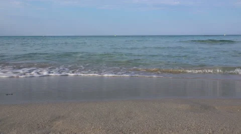 Edge of water on beach, easy waves caress the sand. Stock-Footage 40008754