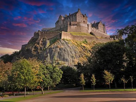 Edinburgh Castle with dramatic evening sky colors Stock Photos