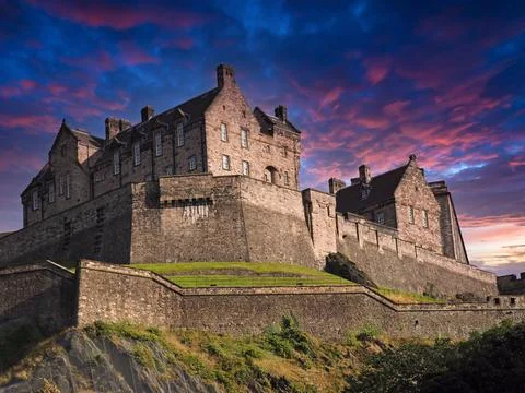 Edinburgh Castle with dramatic evening sky colors Stock Photos