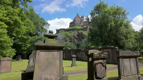 Edinburgh Castle seen from St Cuthberts Kirkyard Stock Footage 278030065