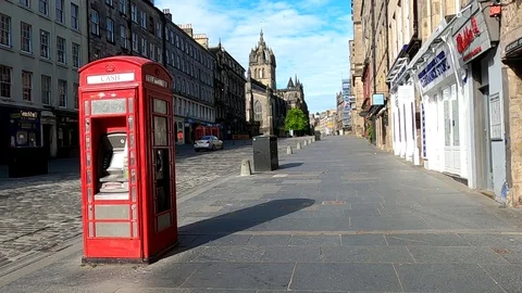 Edinburgh Lockdown Covid 19 Coronavirus Red cash machine Royal Mile Scotland UK Stock Footage 130136904