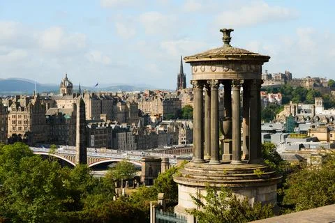 Edinburgh skyline with classical monument and castle under bright summer sky Stock Photos
