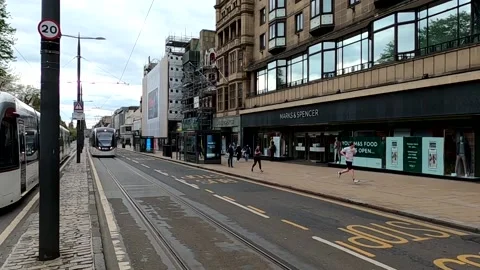 Edinburgh Tram approaching to stop in Princes Street Scotland UK Stock Footage 130305498