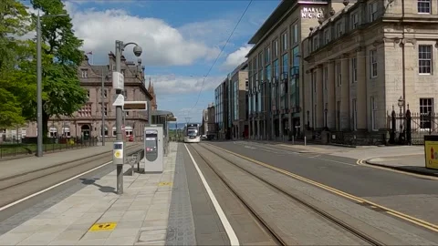 Edinburgh Tram approaching stop in St Andrews Square Scotland UK Stock Footage 131071190