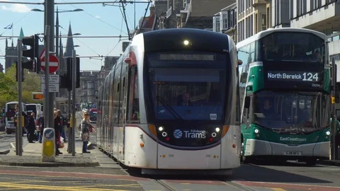 Edinburgh Trams and Buses Public Transportation Network in City Center Stock Footage 121083984