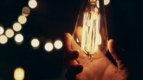 Edison Bulb Screwed In/Turned On Stock Footage 50934267