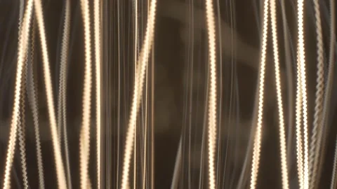 Edison lamp close up, vertical glowing lines. Video stock 133627283