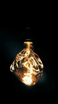 Edison lamp on a dark background Stock Photos