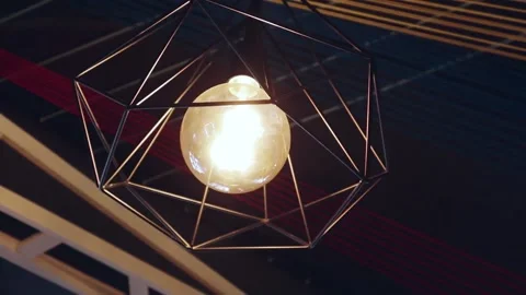 Edison lamp hanging indoors on the ceiling Видео 200204152