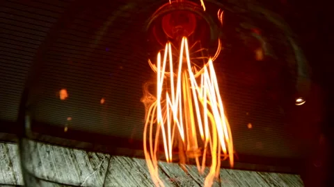 Edison light bulb hanging in a restaurant in Spain Stock Footage 221728593