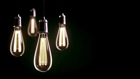 Edison light bulbs glowing in dark room with cinematic mood. Stock Footage 340621853