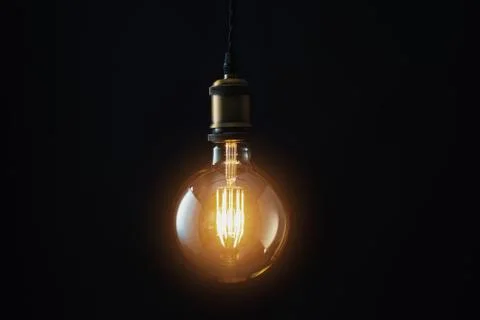 Edison Lightbulb on black background Stock Photos