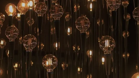 Edison tunsteen vintage light bulbs in darkness Stock Footage