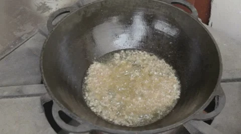 EDIT Boilining chicken fat in cauldron Stock-Footage 7752926