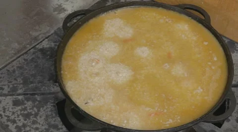 EDIT Pilaf keeps simmering in cauldron Stock-Footage 7753018
