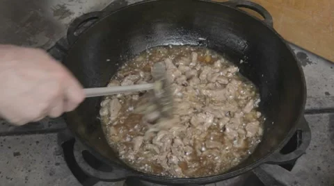 EDIT Preparing meat with onions for pilau Stock-Footage 7752984