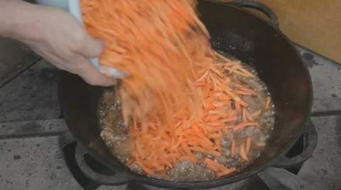 EDIT Spreading chopped carrot in well-stewed meat Stock Footage 7752985