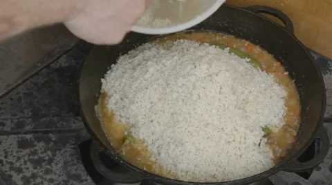 EDIT Spreading on top of stewing vegetables and pork rice Stock-Footage 7753012