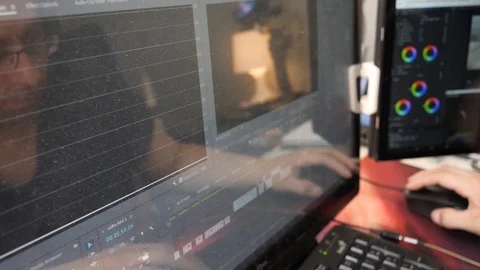 Editing in Adobe Premiere Pro and Color Correcting on a Dusty Monitor Stock Footage 119252132