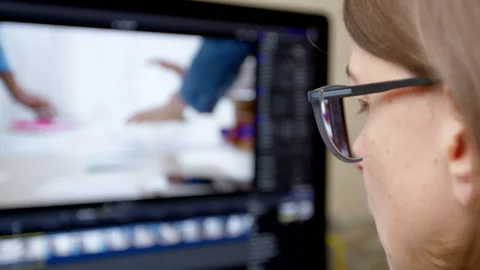 The editing director works with video on a computer. Vídeo Stock 255125767