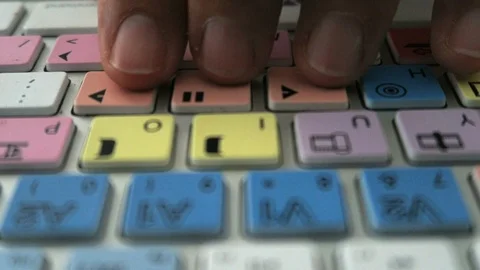 Editing keyboard Avid  fingers press play, pause. Stock Footage 112852634