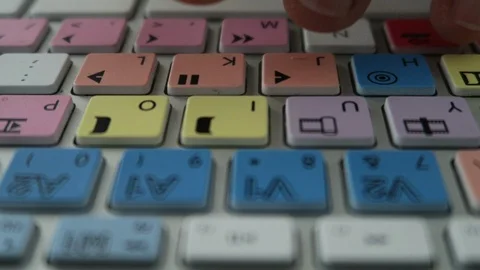 Editing keyboard Avid  fingers press play, pause Stock Footage 112853564