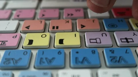 Editing keyboard Avid  fingers press play, pause, Stock Footage 112853600