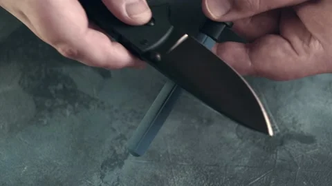 Editing pocket folding knife with Ceramic Sharp Stick or rod, knife sharpening Stock Footage 168211808