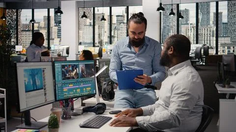 Editing video footage, on computer, with video editors, working on media content Stock Photos