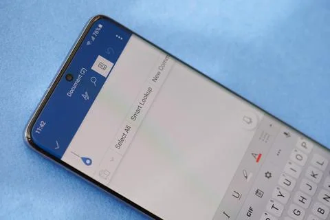 Editing word document on smartphone Stock Photos