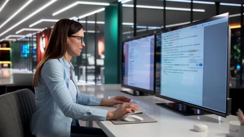 Editor Carefully Reviews Text On Computer Screen Stock Footage 331523722