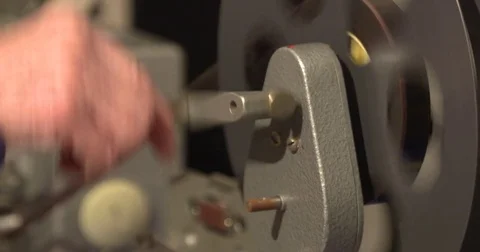 Editor at work, using a vertical film viewer - close up hand winch 動画素材 75677070