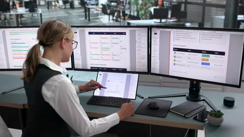 Editor Working On Computer To Review Stock Footage 340999661