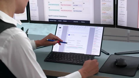 Editor Working On Computer To Review Stock Footage 342971167