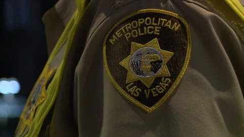 Editorial - 10-8-17 - Las Vegas Shooting Scene - Police Man Patch Vídeos de archivo 99377714