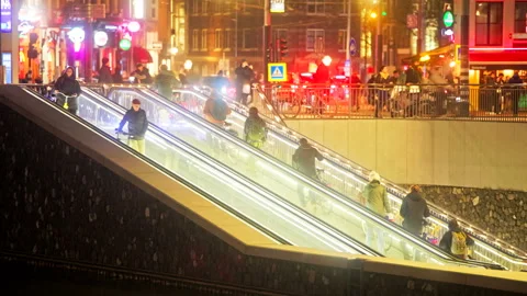 Editorial 4K Cyclists Using Bicycle Escalator at Amsterdam Central Station Stock Footage 339048319
