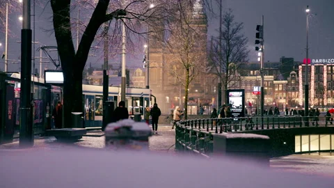 Editorial 4K Stationsplein Facing Basilica of St. Nicholas During Snowy Evening Stock Footage 338441179