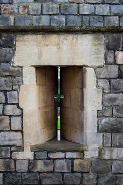 EDITORIAL: Archer's loop-hole in a Windsor Castle wall, England Stock Photos