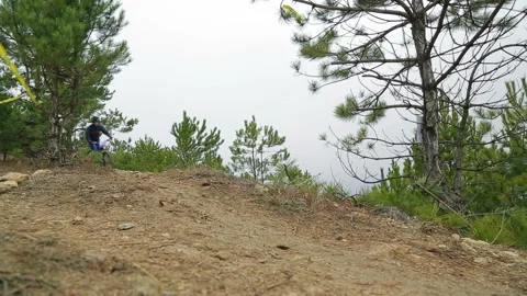 Editorial. Bicycle racer descends from a steep slope. Stock Footage 120424327
